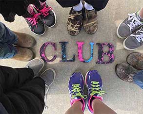 Kids feet encircling the word Club